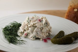 Easy Tuna Salad with Fresh Dill on a white plate with fresh dill and cornichons