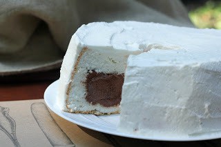 Side view of Mousse Filled Angel Food Cake with a slice removed