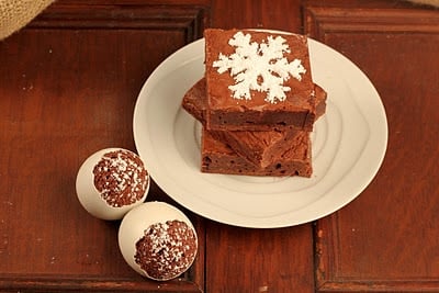 A plate of food sitting on top of a wooden table, with Chocolate