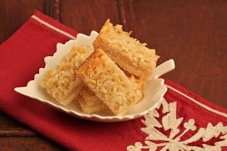 Coconut Macadamia Nut Bars in a leaf shaped ceramic bowl.