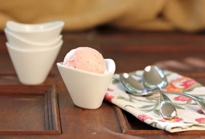 A cup of coffee on a table, with Ice and Ice cream