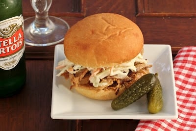 Pulled Pork Sandwiches - Slow roasted pork with an amazingly flavorful dry rub is shredded and mixed with a vinegar based BBQ sauce Pulled Pork Sandwiches