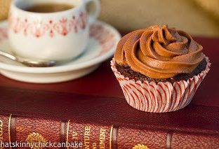 chocolate cupcake on a book