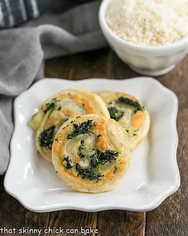 Muenster and Spinach Pinwheel Recipe on a square white plate.