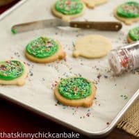 Sugar cookies on a baking sheet with sprinkles