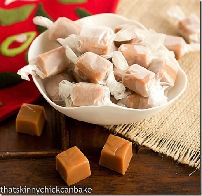 Brown Sugar Caramels wrapped in wax paper in a white bowl.