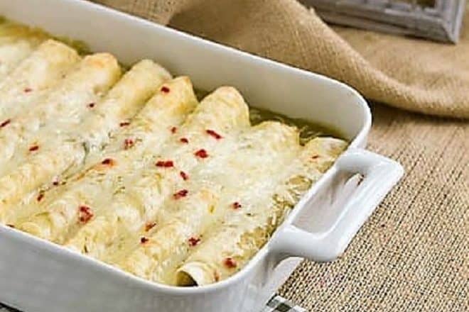 Creamy chicken enchiladas in a casserole dish