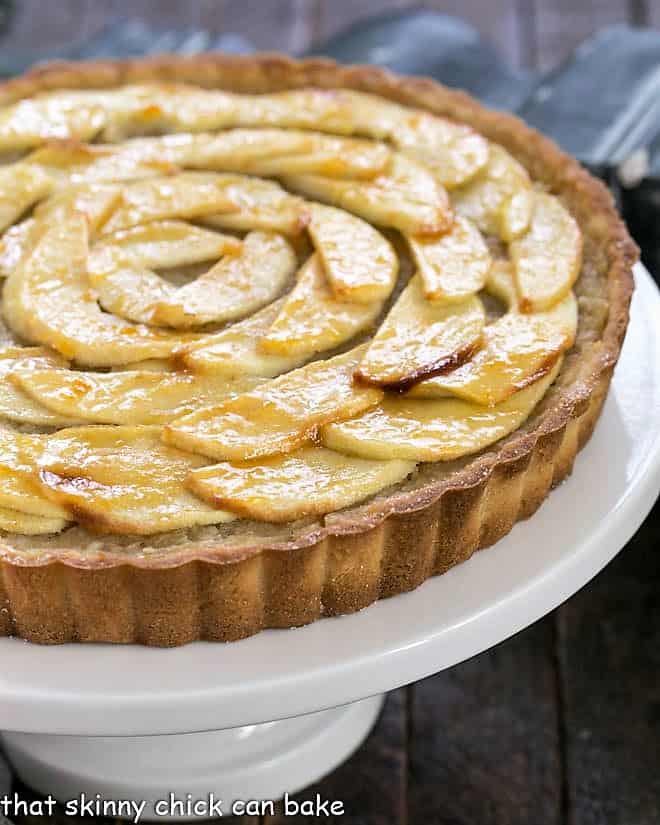 French Apple tart on a white cake stand