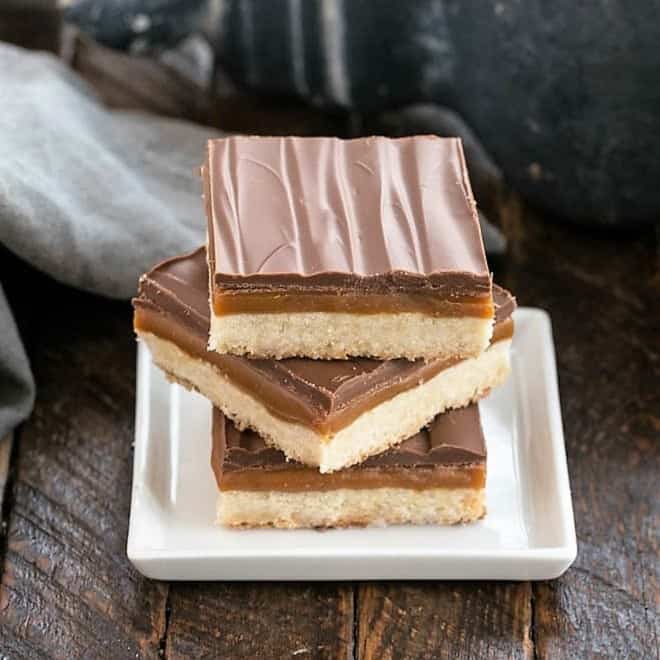 3 twix bars stacked on a square white plate