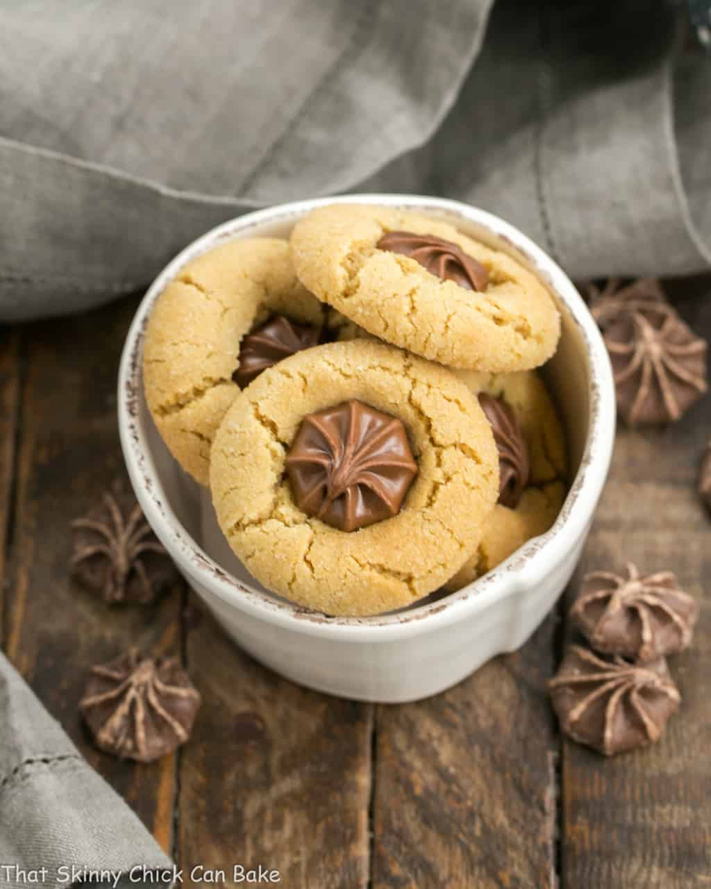 Peanut blossoms in a small white bowl.