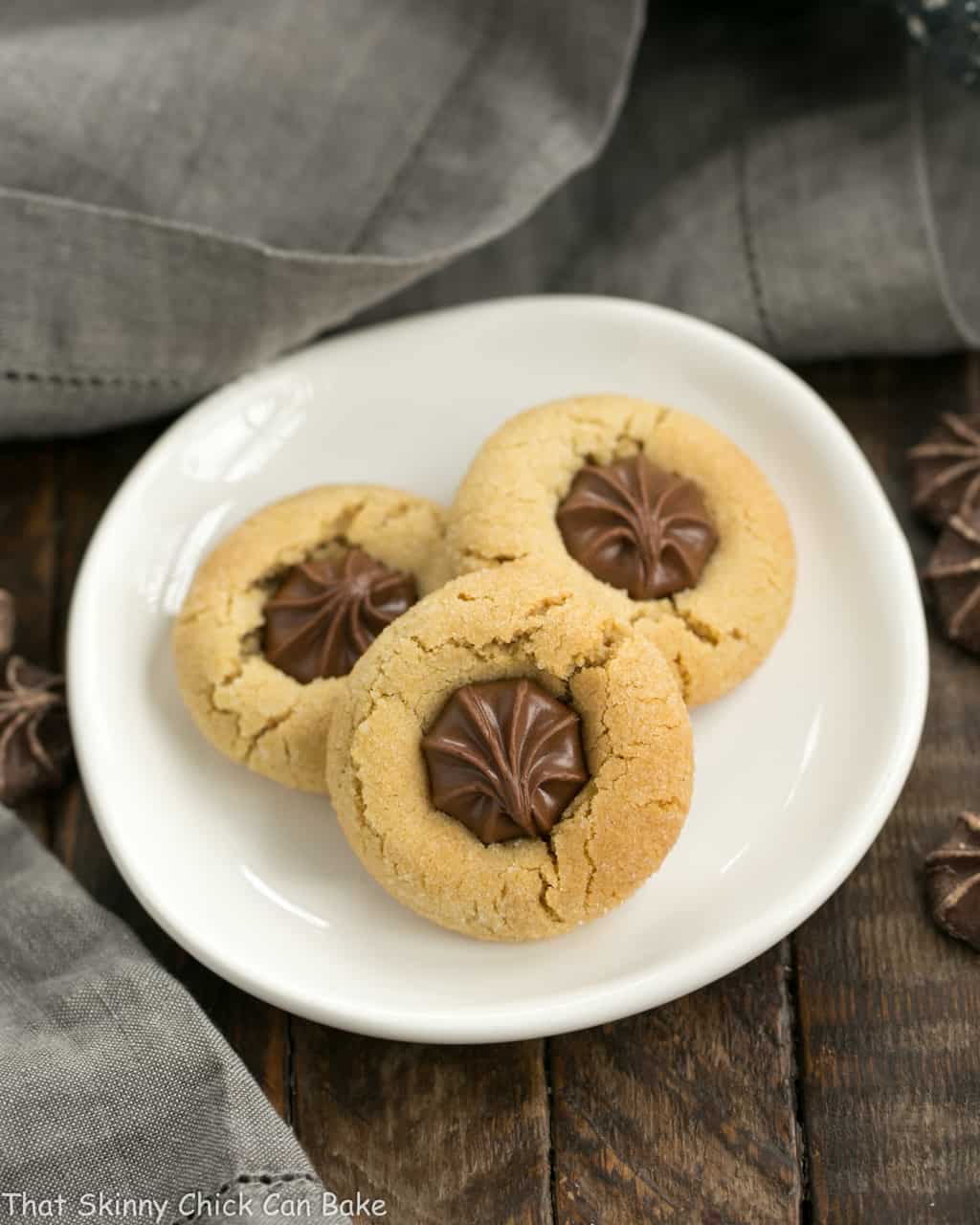 Peanut blossoms on a small white plate.