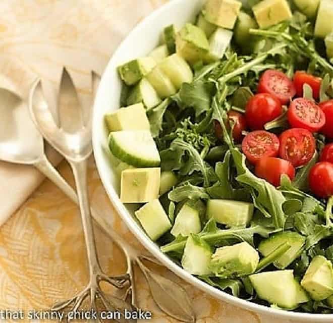 Maddy's Arugula Salad in a white ceramic serving bowl.