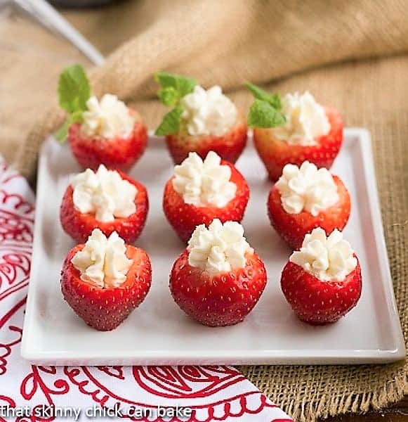 Mascarpone Filled Strawberries on a square white serving tray.