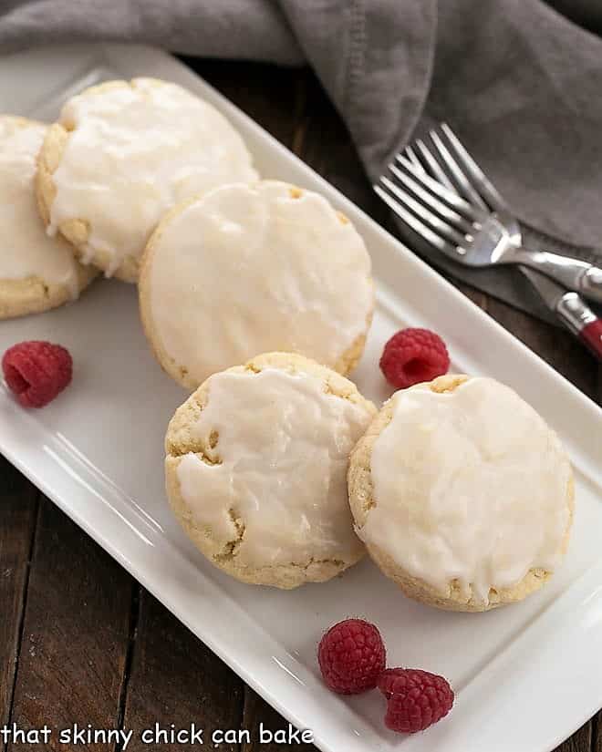 Tray of the best scone recipe with raspberries to garnish.