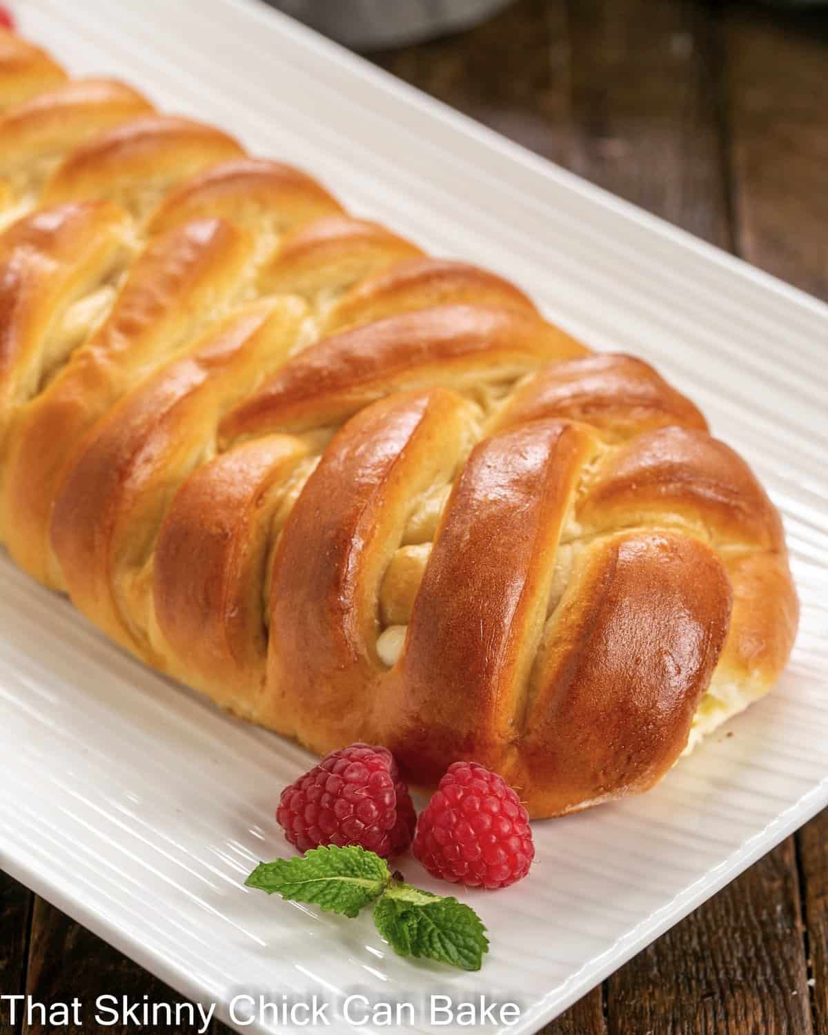 Cream cheese filled Easter bread on a white serving dish.
