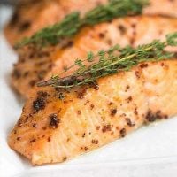 Maple Mustard Glazed Salmon fillets on a white serving tray