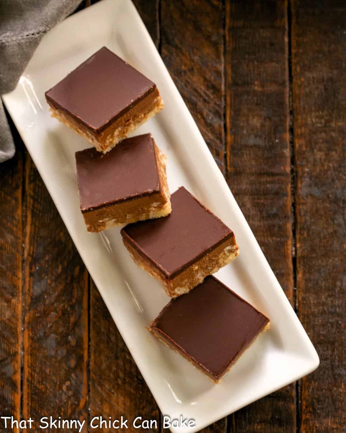 Peanut Butter Rice Krispie Treats on a narrow white tray.