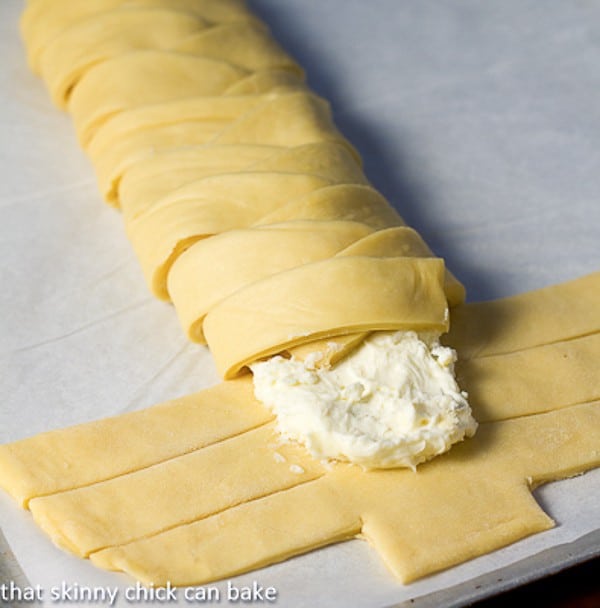 Plaited Easter Bread dough sliced and folded over the cream cheese filling.