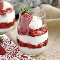 No-Bake Strawberry Cheesecake Parfaits layered in clear drinking glasses