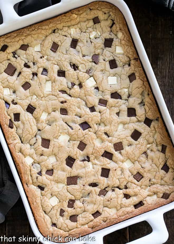 Overhead view of white ceramic 9 x 13-inch baking pan filled with chocolate chunk cookies