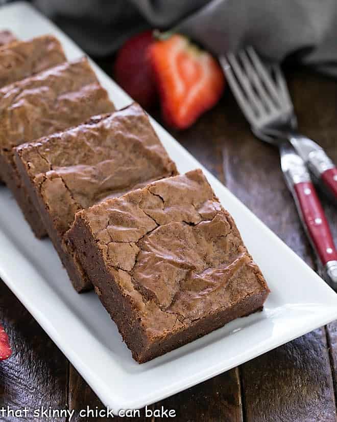 Fudgy Brownies from Scratch on a white ceramic tray.