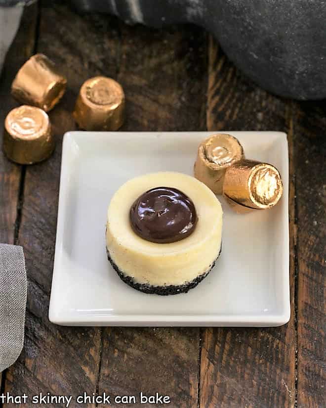 One Rolo Cheesecake on a white plate viewed from above