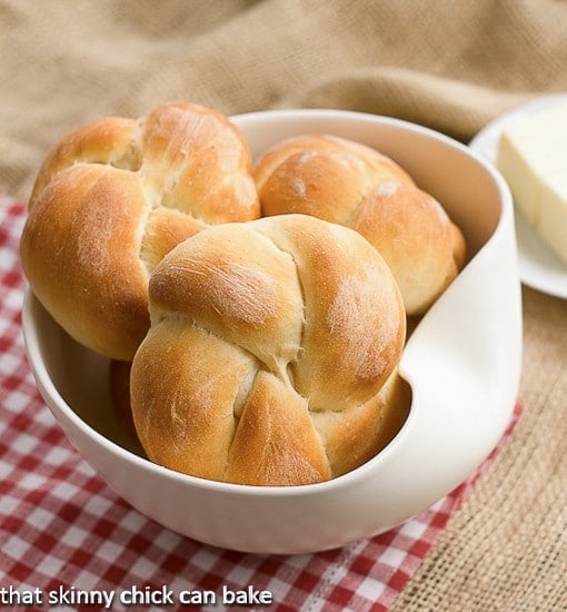 Moomie's Buns in a white bowl on a red checked napkin.