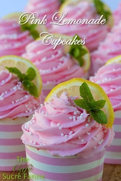 Pink Lemonade Cupcakes garnished with lemon slices and mint