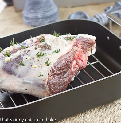 Glazed Leg of Lamb with Garlic and Rosemary in a roasting pan