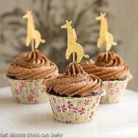 Cocoa Cupcakes with Chocolate Buttercream in floral paper wrappers with a giraffe topper