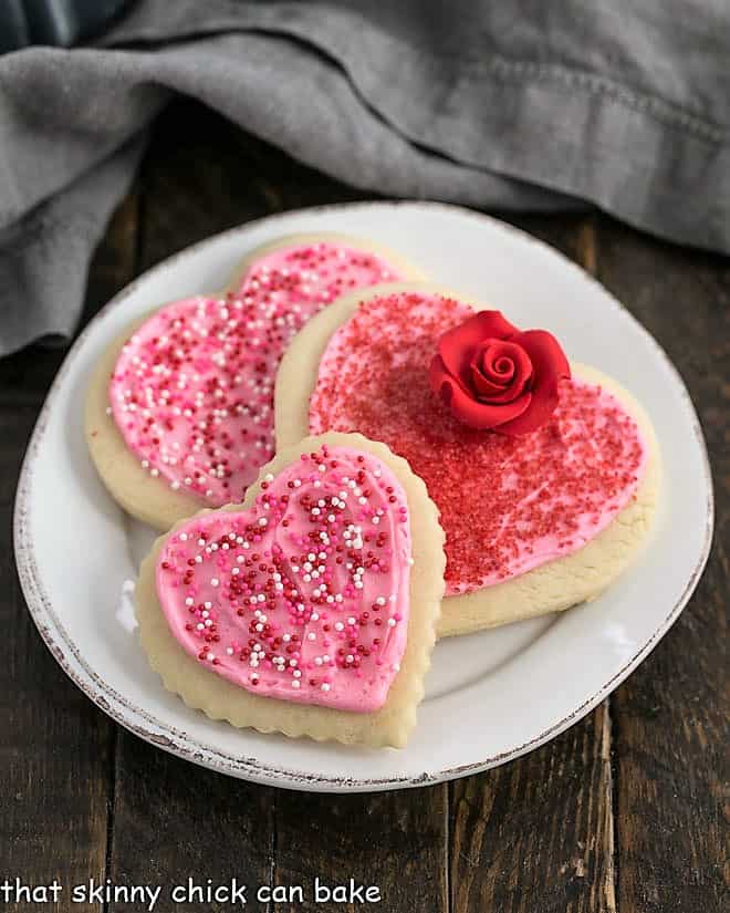 3 Lofthouse cookies on a round white plate.