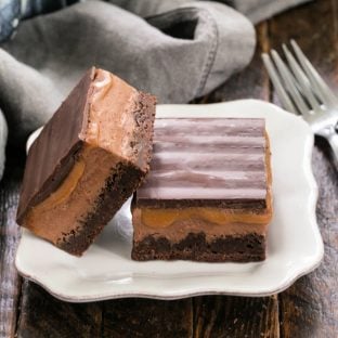 2 milky way brownies on a square white plate