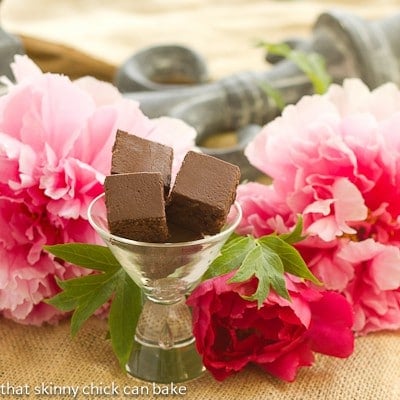 Refrigerator Brownies in a martini glass with peonies surrounding them