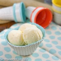 Vanilla Bean Ice Cream in a white and turquoise ice cream bowl on a polka dot napkin