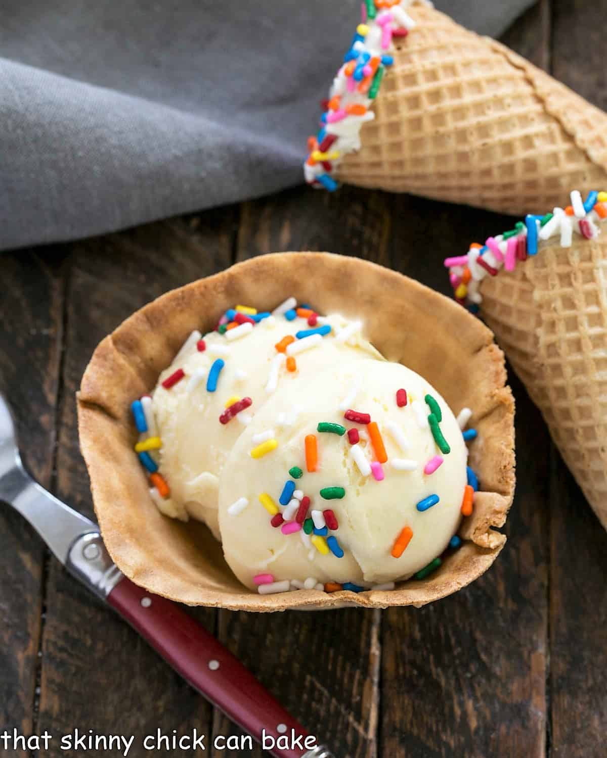 Cake Batter Ice Cream in a sugar cone dish plus with sprinkle cones.