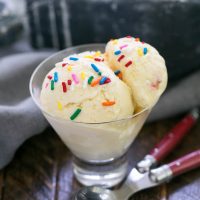 2 scoops of cake batter ice cream in a glass dish
