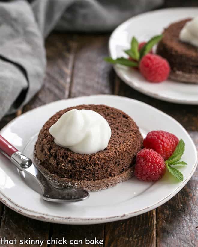 Lava cakes garnished with cream and berries