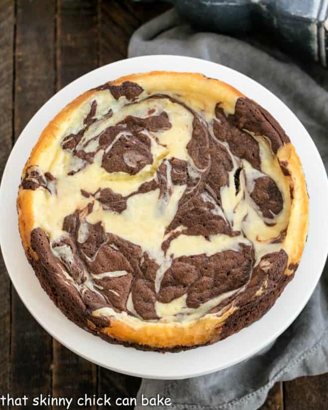 Marbled Overhead view of Marbled Flourless Chocolate Cake on a white cake stand