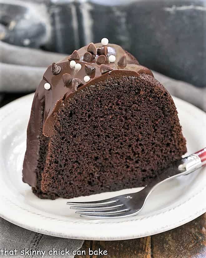 Slice of Chocolate Sour Cream Bundt Cake on a white plate