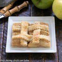 Slice of apple slab pie on a square white plate