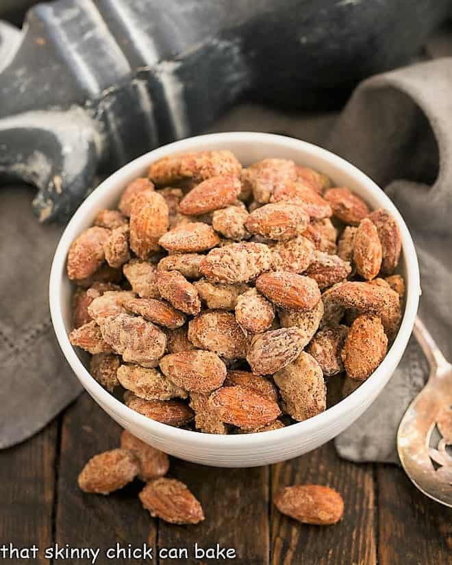 Overhead view of vanilla almonds in a white serving bowl.