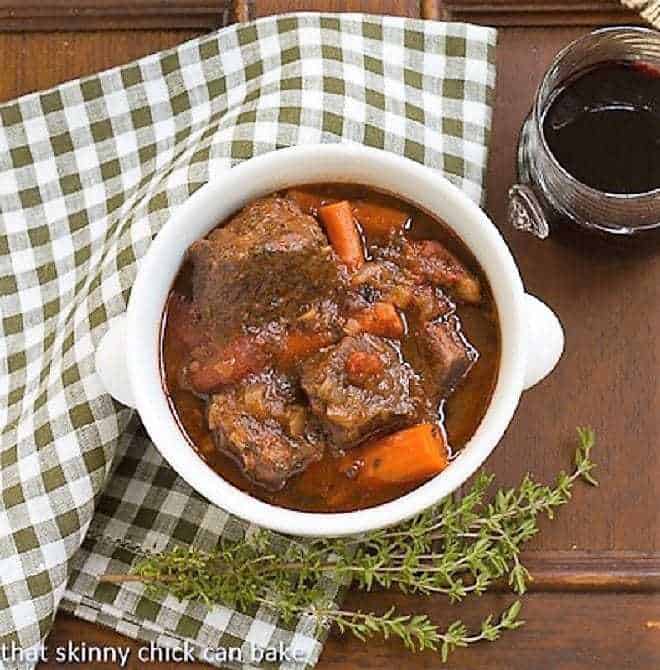 Overhead view of Slow Cooked Beef Stew with Red Wine, Carrots and Tomatoes.