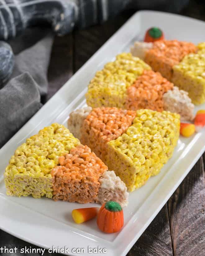 Candy Corn Rice Krispie Treats on a white tray.