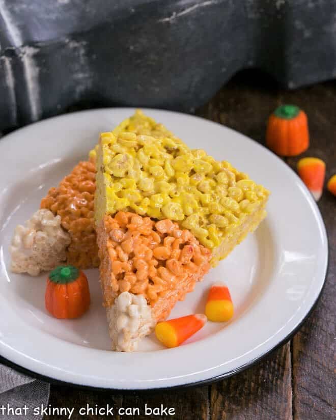 Candy Corn Rice Krispie Treats on round white plate.