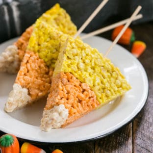 Candy Corn Rice Krispie Treats on skewers on a white plate