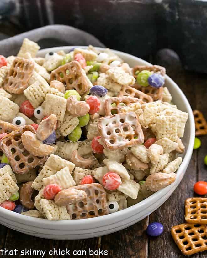 Halloween Chex Mix in a white serving bowl.