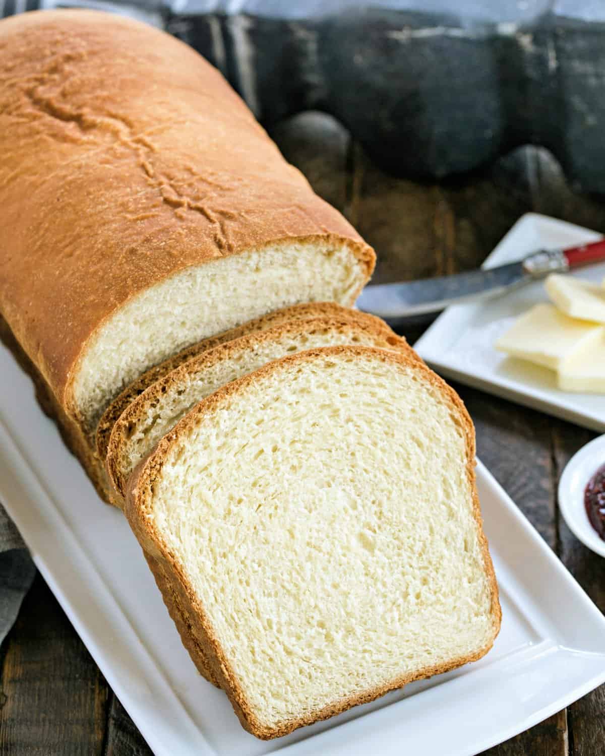 Homemade Potato bread on a white ceramic platter.