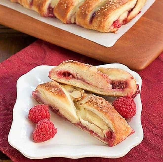 Raspberry Danish Braid slices on a white ceramic plate