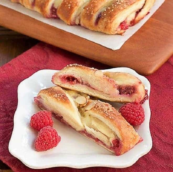 Raspberry Danish Braid slices on a white ceramic plate.