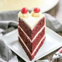 Red velvet cake slice on a square white plate